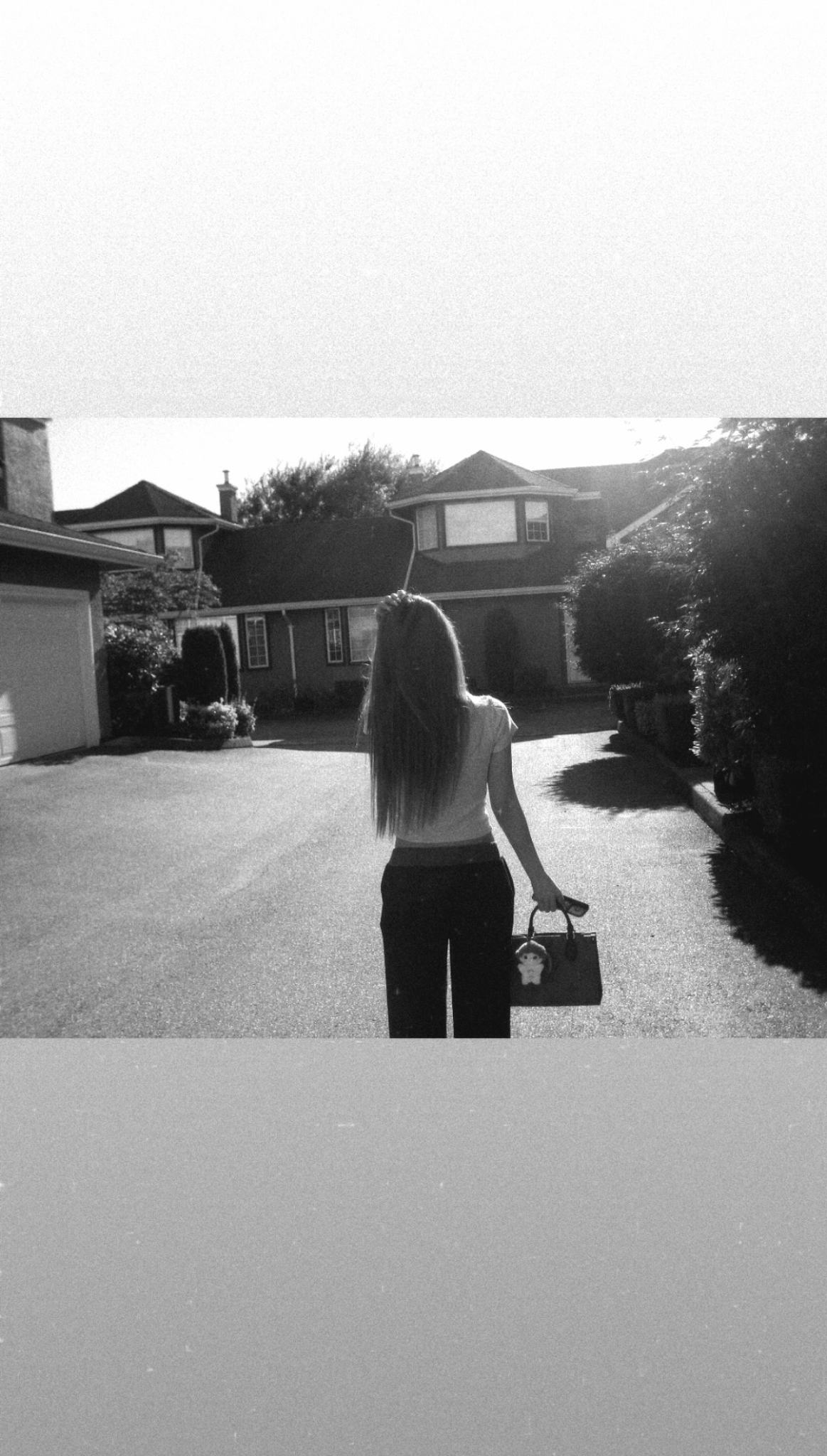 Black and white photograph of a person walking